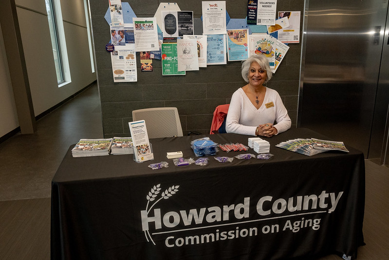 Commission on Aging member manning the Commission on Aging outreach table 