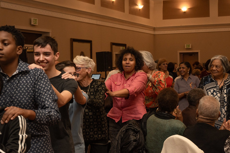 Commission on Aging members at thanksgiving dancing in the congo line 