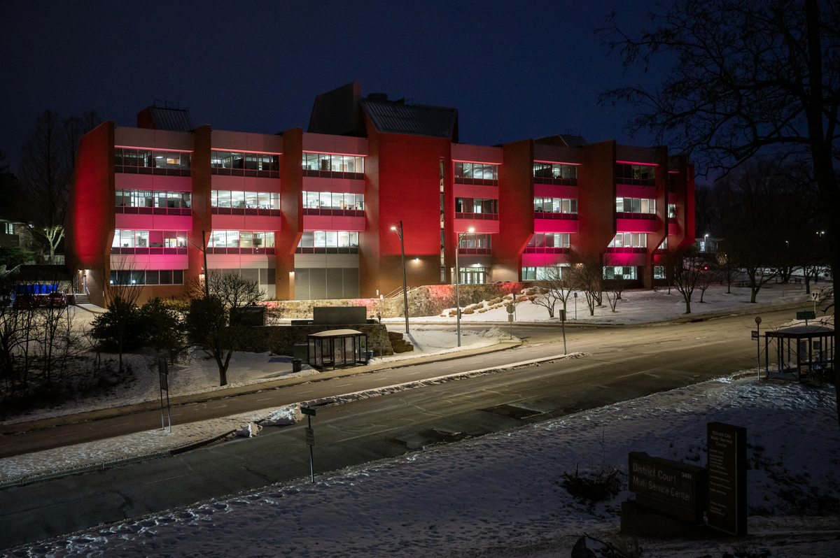 Image of the backside of the County's George Howard Building lit in a burgundy glow in support of the Washington Commanders as they head into the 2024 season NFC Championship in their bid for Super Bowl LIX.