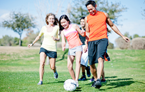 family playing soccer