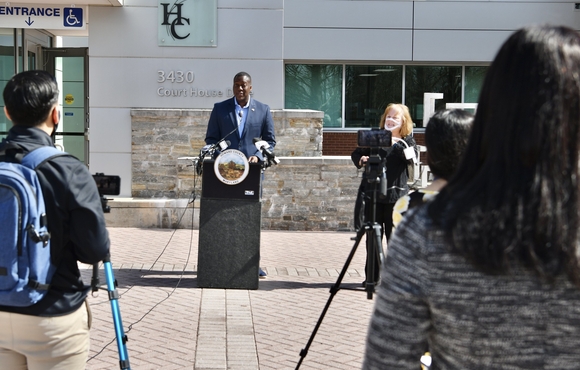 Calvin Ball standing at podium with crowd gathered