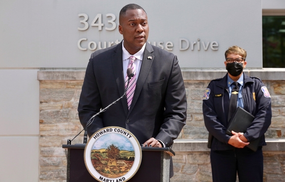 Calvin Ball at podium with Chief Myers in background