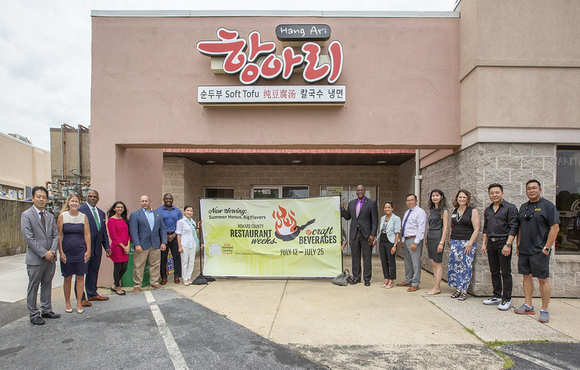 Image of hang ari restaurant with staff and howard county officials 