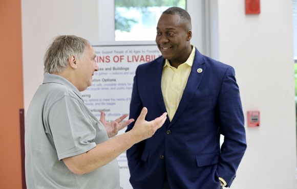 County Executive Ball talking about the Age-Friendly Action Plan with a communitymember.