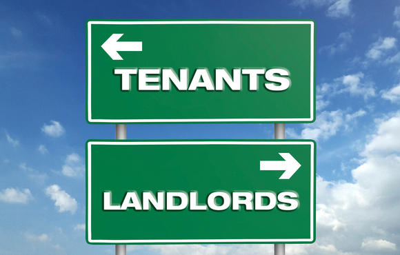 Road signs with arrows and the words tenants and landlord