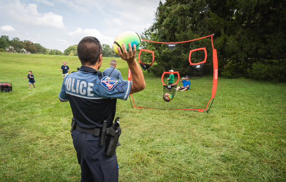 Officer playing sports with neighborhood children