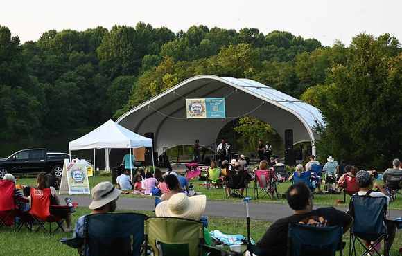 crowd enjoys a concert at the Centennial Park amphitheater