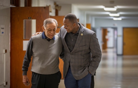 A photo of County Executive Calvin Ball walking with former Delegate Frank Turner Sr.