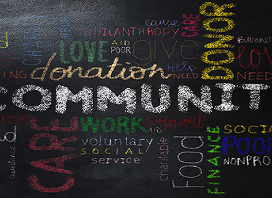 Colorful words on chalkboard describing community