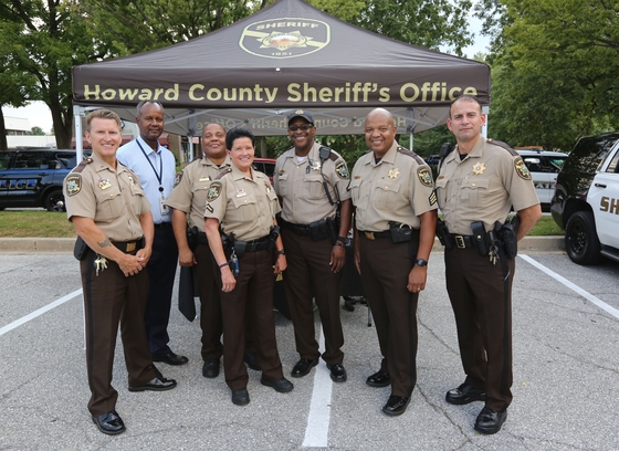 Group of sheriff's deputies in front of a howard county tent