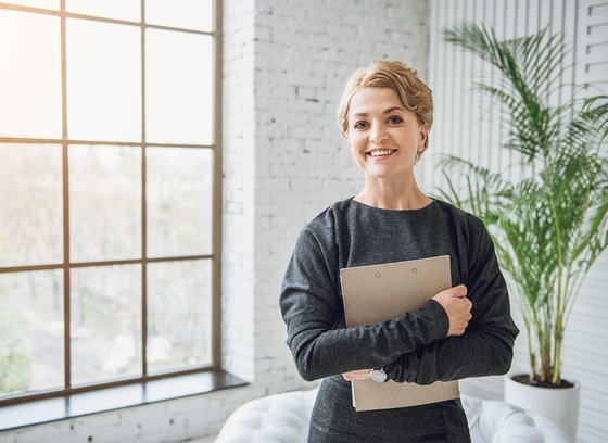 female holding folder