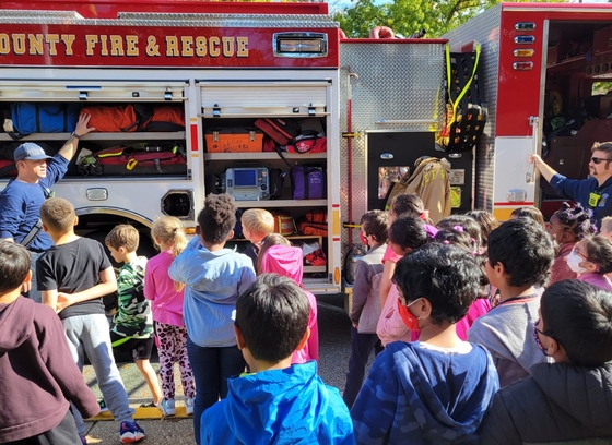 HCDFRS firefighters teach students about fire engine