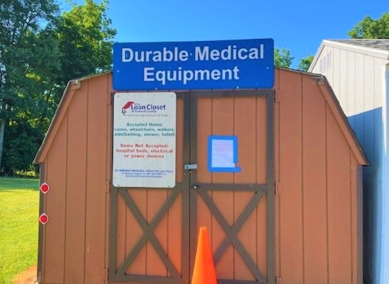 The Loan Closet shed with a red cone in front of it at Alpha Ridge Landfill