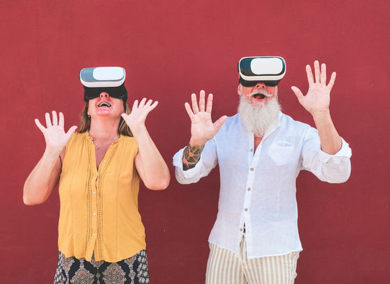 Mature couple with virtual reality set 