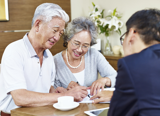 Couple being shown paperwork