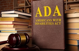 Books with ADA Print on the cover and a gavel.