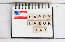 Image of notebook that reads happy labor day