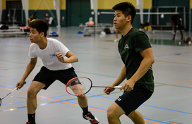 two men playing badminton