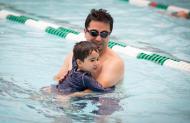 Father with young son in pool