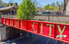 A photo of the famous red railroad sign that reads Ellicott City