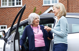 Older adult getting car ride from neighbor