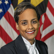 tsega girma-kyere posing in front of Flags