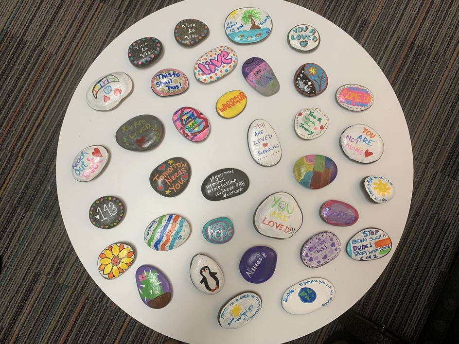 painted stones on a table