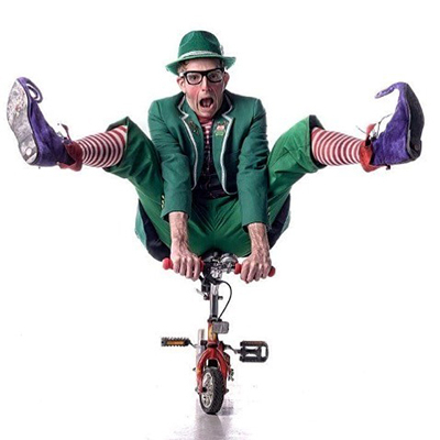 Performer "Cricket" riding on a tiny bicycle