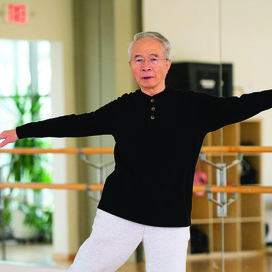 older man exercising in a studio